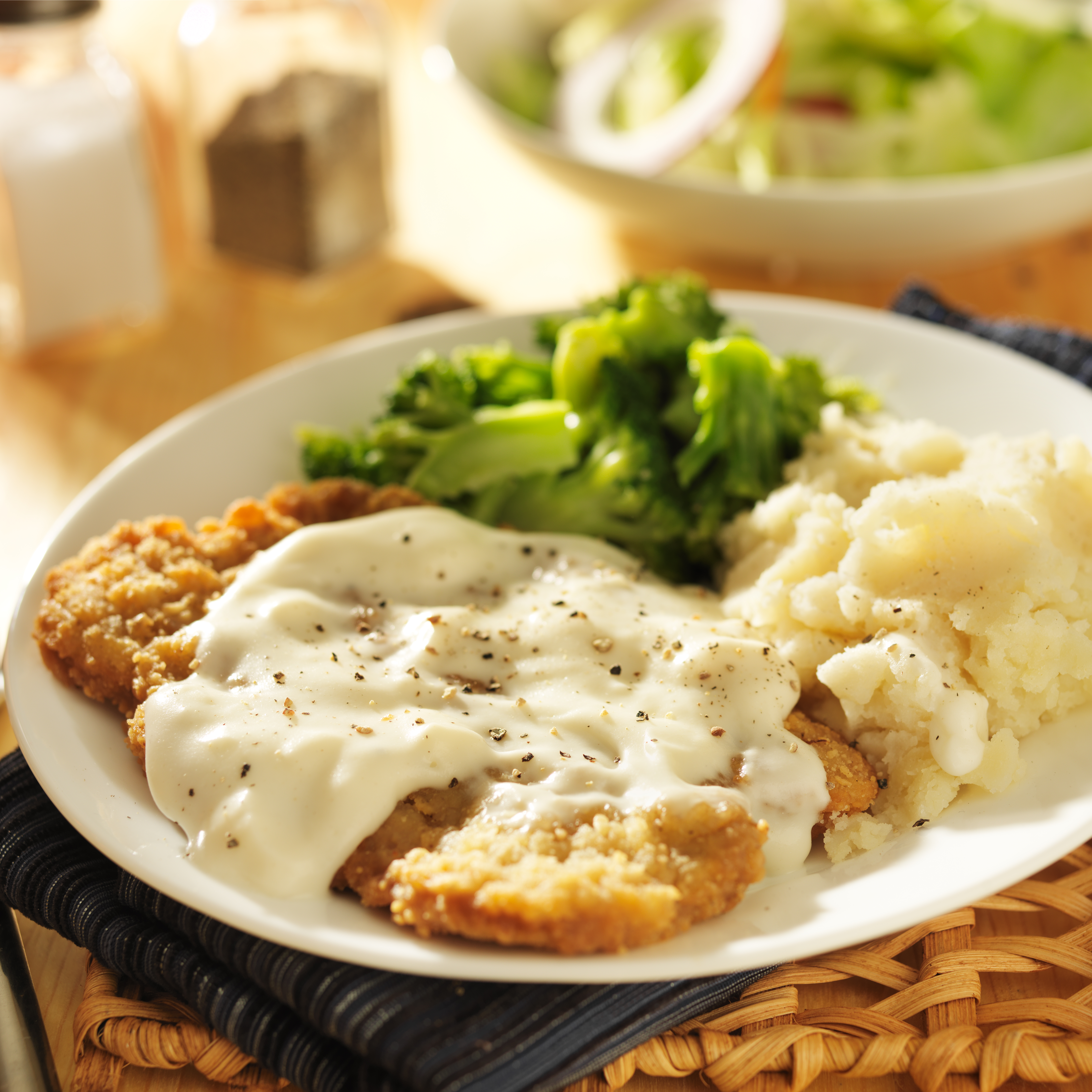country fried steak with southern style peppered milk gravy